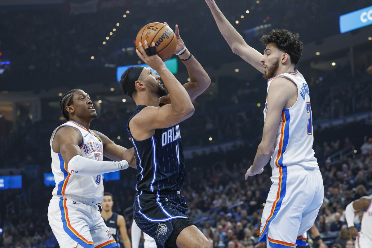 Orlando Magic guard Jalen Suggs (4) drives on Oklahoma City forward and former Minnehaha High School (Minnesota) teammate Chet Holmgren (7) on Jan. 13.